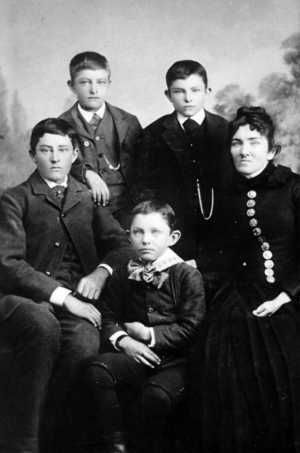 A family portrait from the early 1880s. Joseph, the youngest son, is in front; in the back, from left to right, are Arthur, Bailey, Harold, and Annabelle McPherson Hutchinson.