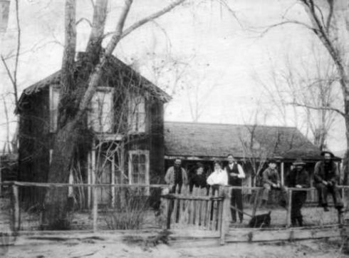 The homestead and family in 1908. Left to right are Bailey Hutchinson, born October 27, 1872, at Poncha Springs; his mother, Annabelle McPherson Hutchinson; Gertrude D&uumlaut;rsen Hutchinson and her husband, Joseph M. Hutchinson, who was born July 3, 1877 in the home; Mills Hutchinson, a nephew of the Hutchinson brothers and father of Dr. Wendell Hutchinson; John Duncan McPherson, brother of Annabelle Hutchinson; Arthur Hutchinson, born November 16, 1870 at Poncha Springs.
