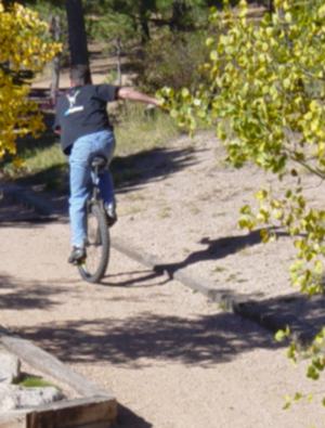 Unicyclist on mountain trail