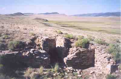 Stone foundation at abandoned King Mines looking south from the #4 Mine toward the spoil mounds at the heads of the #2 and #6 mines