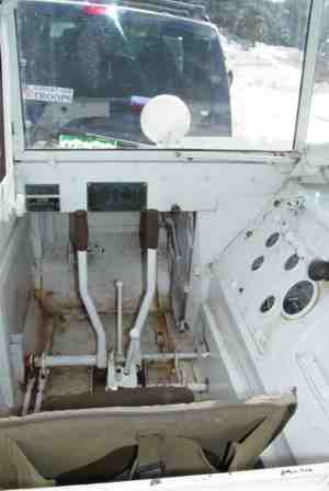 The driver's compartment of a World War II Weasel snow tractor.