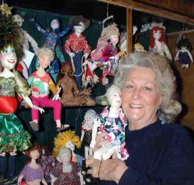 Laura Lunsford with some of her dolls.