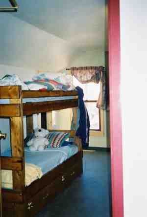 Resident-built bunkbeds with storage drawers at La Puente
