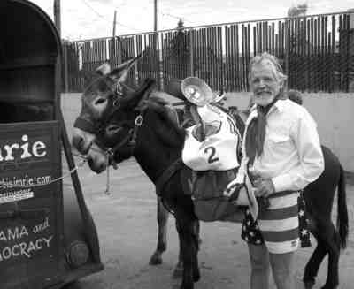 Mordecai the mascot is the front donkey, behind his owner, Curtis Imrie of Buena Vista.