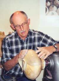 [Bob Gray polishing a vessel. Photo by Clint Driscoll.]