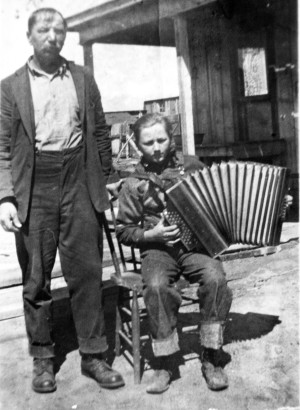 Frank Shine Sr. with John Shine, Sr. on accordian (Rich’s father), taken in 1925 in front of their home in Smeltertown next door to Joe and Annie Shine now owned by Erik Hvoslef and Merry Cox.