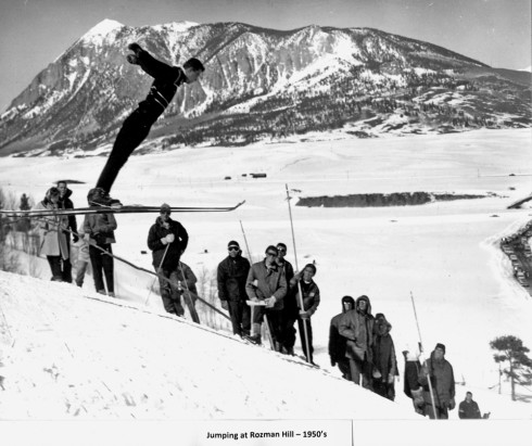 A ski jumper at Rozman Hill, which operated from 1951-60 and was located five miles south of Crested Butte. In the background is Crested Butte Mountain. courtesy of Duane Vandenbusche