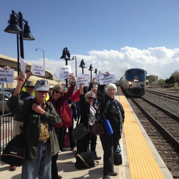 A contingent of Salidans greets the Amtrak Southwest Chief with signs of support as it arrives in Trinidad, Colorado for a trip to Las Vegas, New Mexico on Saturday, May 9, Train Day. The route, which stretches from Chicago to Los Angeles, is in danger of being permanently rerouted due to aging tracks and the need for major upgrading.  In late May, efforts by Republican state Sen. Larry Crowder of Alamosa finally paid off as the Colorado Department of Transportation Commission voted unanimously to approve $1 million toward the train’s preservation. A federal transportation grant to help with repairs requires matching funds from states served by the route. Photo by Daniel Smith.