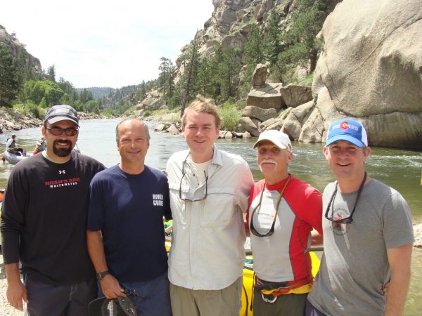 Colorado Sen. Michael Bennet poses with members of the regional rafting industry during a lunch break on a river trip down Browns Canyon with other dignitaries, including Colorado Gov. Hickenlooper and USFS Chief Tom Tidwell, to celebrate the official designation of Browns Canyon National Monument on July 18. Pictured from left to right are: Micah Salazar, Noah’s Ark Rafting; Joe Greiner, Wilderness Aware Rafting; Bennet; Bob Hamel, Arkansas River Tours; and Mike Kissack, American Adventure Expeditions. President Barack Obama used the Antiquities Act to designate the nearly 22,000 acres of public land as a National Monument this past February. Among those participating in the ceremony were: U.S. Interior Secretary Sally Jewell, U.S. Rep. Diane DeGette, and BLM director Neal Kornze. Photo courtesy of Wilderness Aware Rafting.