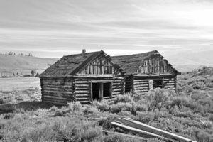 After the land was sold, it ended up in the hands of a mining company. A dredge went into operation in 1915, and the following year, five log cabins were constructed for workers.