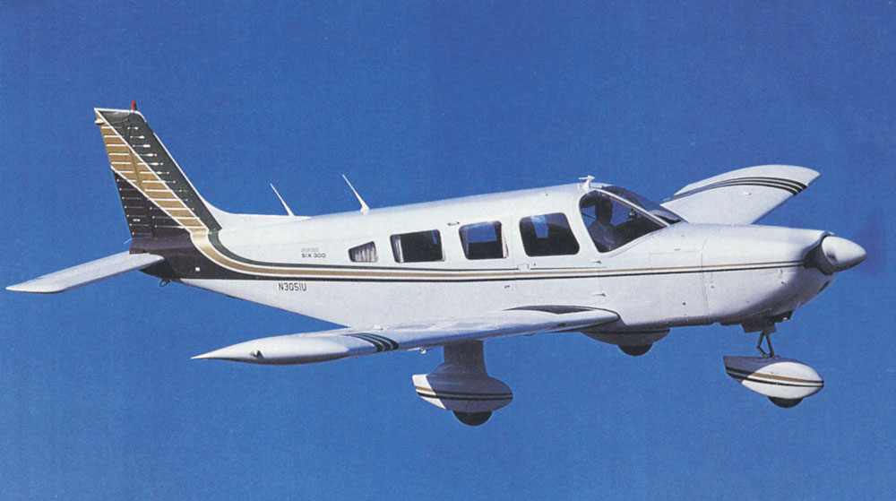 A Piper Cherokee Six aircraft, similar to the one flown on the ill-fated day. At right: The red arrow indicates the location of Stout Creek Lakes in this aerial view courtesy of the Colorado Civil Air Patrol